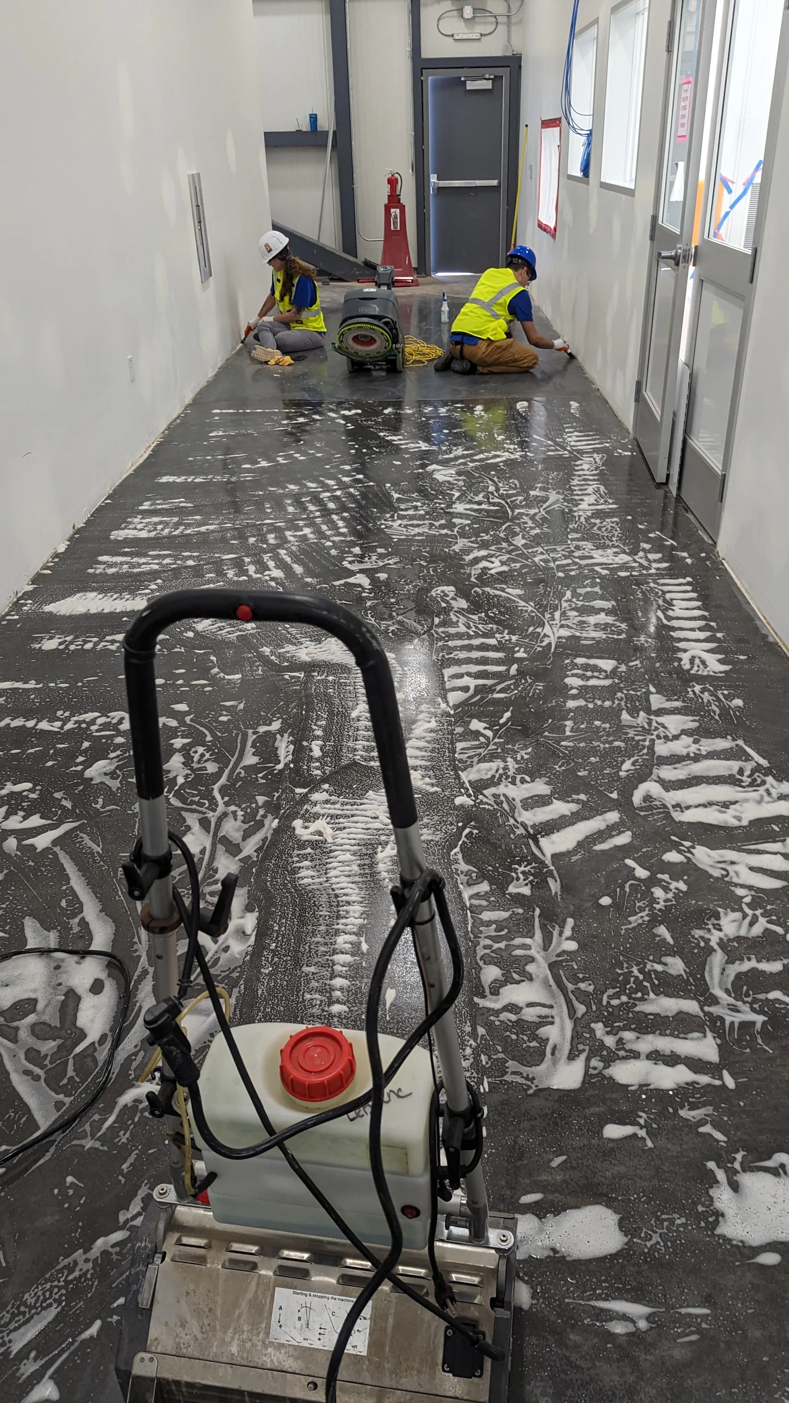 LeBlanc Cleaning crew scrubbing and waxing commercial floors in an East Valley, AZ office building