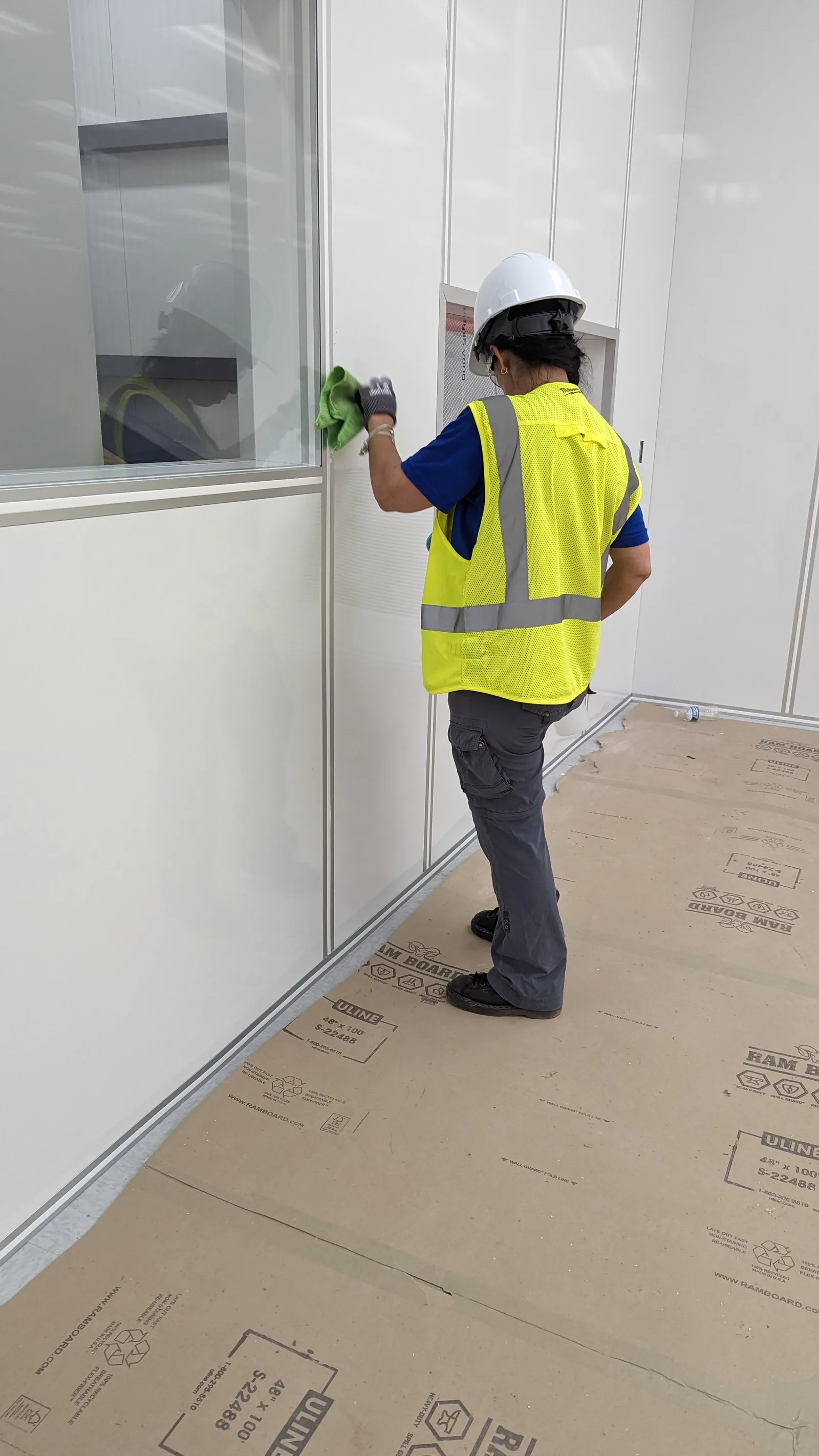 LeBlanc Cleaning technician detailing walls and windows during post-construction cleanup in Mesa, AZ